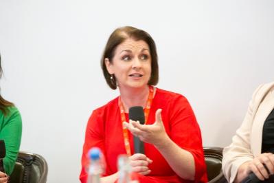 Lady talking with microphone in hand